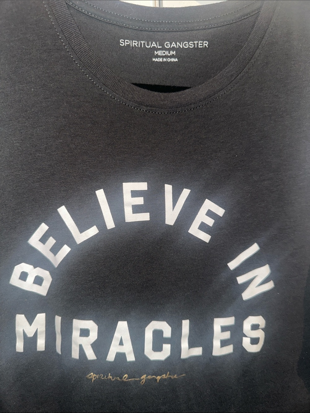 Spiritual Gangster Black Tee with White 'Believe in Miracles' Print
